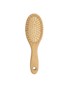 El Cepillo Cabello Bambú Pequeño NaturaBIO Cosmetics masajea el cuero cabelludo y lo desenreda.